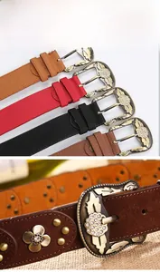 Details von Vintage Ledergürteln mit Strassschnalle und floralen Metallnieten