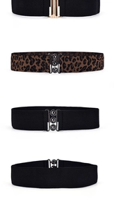 Detail of elastic waist belts in solid black and leopard print with metal buckles