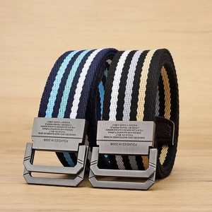 Detailed view of woven elastic canvas belts with matte metal buckle and stripe patterns