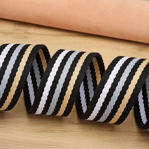 Unisex elastic woven belt with multicolor stripes on a natural wooden background