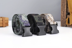 Close-up of three military camouflage canvas belts with durable plastic buckles
