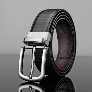 Men's leather business belt with silver pin buckle displayed on a sleek reflective surface