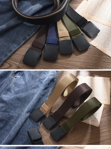 Close-up of tactical nylon canvas belts in multiple colors with matte plastic buckles