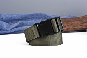 Detail of army green nylon tactical belt with high-strength plastic buckle and woven texture