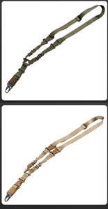 Detail of tactical slings with elastic bungee cords and metal snap hooks in army green and tan