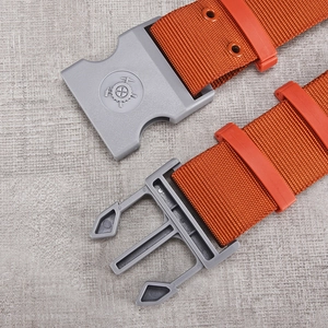 Orange nylon tactical belt with grey quick-release buckle for outdoor and emergency use