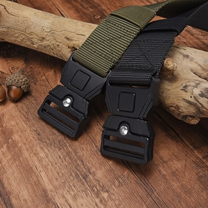 Outdoor tactical nylon belt display with quick release alloy buckles on wood surface