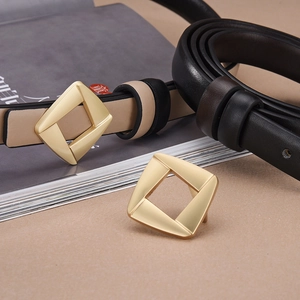 Slim leather belts for women in black and beige with a gold diamond-shaped metal buckle