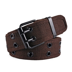 Detail of dark brown canvas belt featuring double-row metal eyelets and black matte buckle