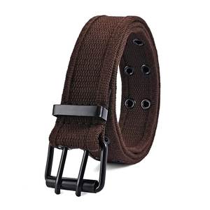 Detailed close-up of dark brown canvas belt with double grommets and black matte buckle