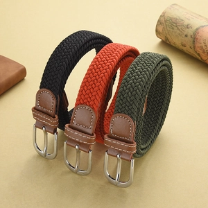 Three colors of braided elastic belts with silver metal buckles and leather end details