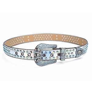 Detail of holographic belt with sparkling blue rhinestones and metal skull buckle