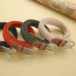 Braided elastic stretch belts in black, orange, green, and beige with silver metal buckles