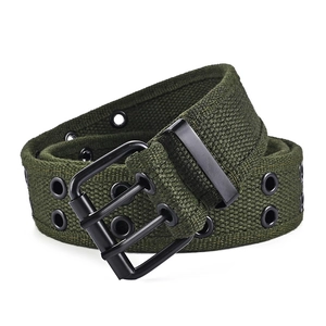 Detail of army green canvas belt with double-prong buckle and metal eyelets