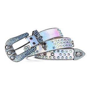 Macro detail of Y2K gothic belt featuring iridescent rhinestones and skull buckle design