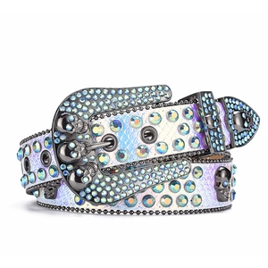 Close-up of hip-hop punk belt with blue rhinestones and black skull buckle detail