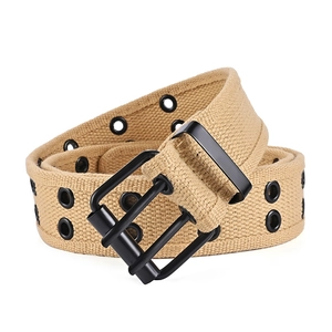 Close-up of khaki double-grommet canvas belt with matte black dual-prong metal buckle