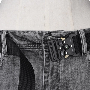 Detailed view of heavy-duty nylon tactical belt with metal cobra buckle and built-in compass