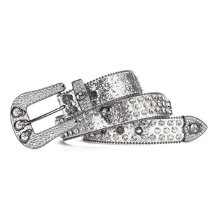 Close-up of gothic punk waist belt featuring skull studs and silver glitter rhinestones