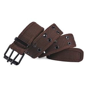 Detail view of coffee brown canvas belt with double rows of metal eyelets and matte buckle