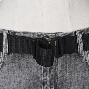 Close-up of black nylon tactical belt with metal quick-release buckle on grey jeans
