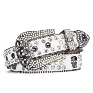 White rhinestone leather belt featuring dark skull rivets and a large studded buckle for women