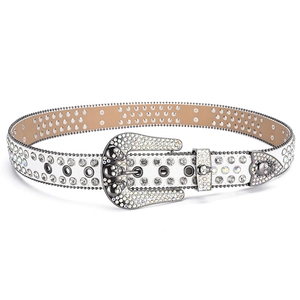 Macro detail of white leather belt featuring iridescent rhinestones and 3D skull buckles