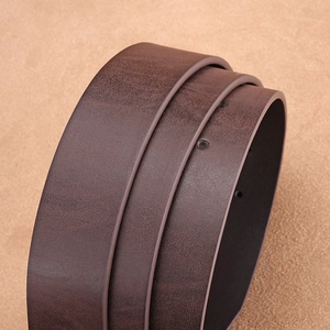 Macro detail of dark brown matte leather belt with clean edge finishing and holes