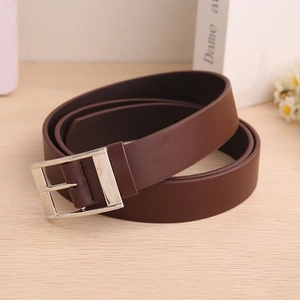 Classic dark brown leather belt with silver metal buckle displayed on a wooden surface