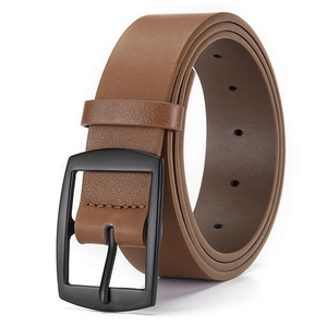 Detail of dark brown leather belt with lychee texture and matte black metal buckle