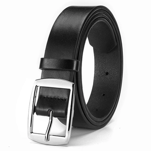 Detailed macro view of black leather belt with polished silver square pin buckle