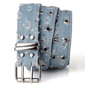 Detail of light blue Y2K denim belt with silver star eyelets and frayed edges