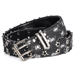Close-up of punk style black denim belt with silver star rivets and metal eyelets