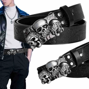 Detail showing vintage silver three skulls buckle and embossed patterns on black belt
