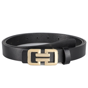 Close-up of minimalist black leather belt with a modern interlocking gold metal buckle