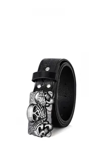 Close-up of vintage silver skull buckle on black punk leather belt with gothic details