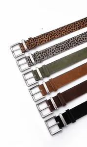 Detail view of premium suede leather belts in leopard print and solid matte finish