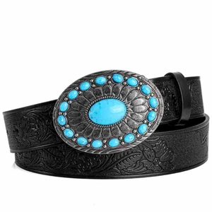 Detail of bohemian black leather belt with floral embossing and turquoise buckle