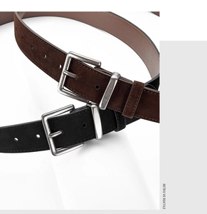 Detail of retro suede belts with silver buckles in black and dark brown colors