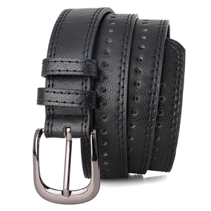 Macro detail of black pebble grain leather belt with double stitching and alloy pin buckle