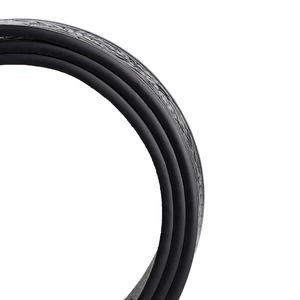Detailed macro view of the embossed floral patterns on the matte black leather belt