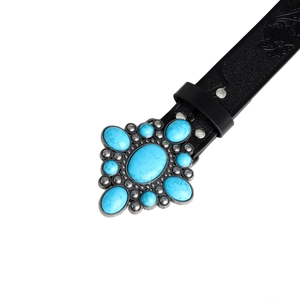 Close-up of bohemian black embossed leather belt with vintage turquoise silver buckle