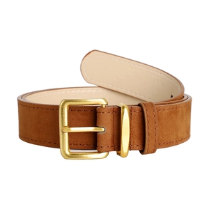 Detailed macro view of brown suede leather belt with polished gold square buckle
