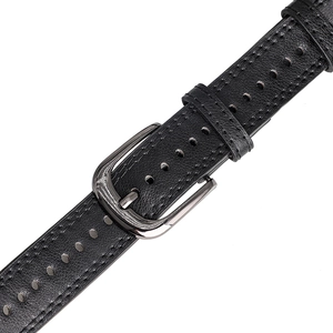 Detail of black leather belt featuring pebble grain texture and gunmetal pin buckle