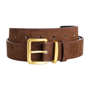 Detail of dark brown suede belt featuring a polished gold rectangular pin buckle