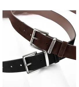 Detail of suede matte leather belts with vintage silver alloy pin buckles in black and brown