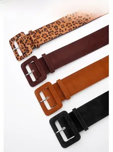 Detail of four wide PU belts in leopard print, brown, tan and black with square buckles