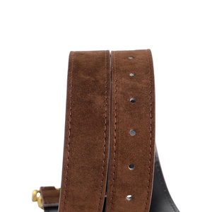Close-up of dark brown suede leather belt featuring reinforced stitching and adjustable holes