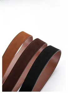 Detail of three matte PU leather belts in brown, coffee, and black with reinforced stitching