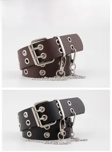 Detail of punk style double eyelet belts in black and coffee with detachable metal chains